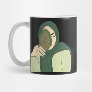 Hijabi Muslim Woman holding a Leaf Mug